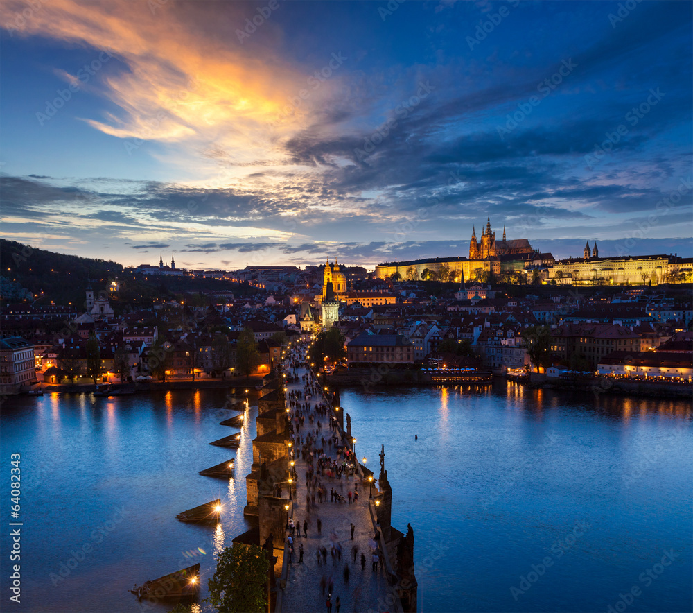 Night view of Prague castle and Charles Bridge over Vltava river