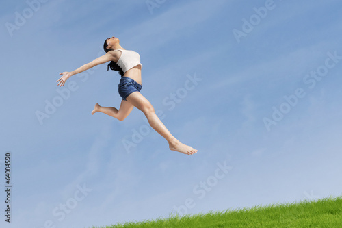Excited woman jumping highly
