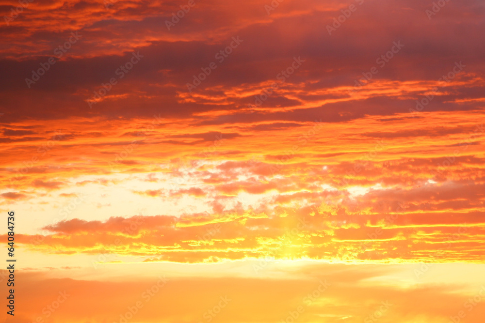 Surreal Orange Sky with clouds at dawn