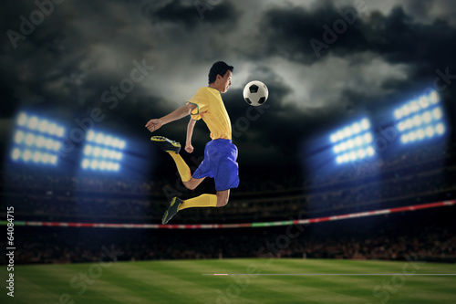 Football player controlling ball