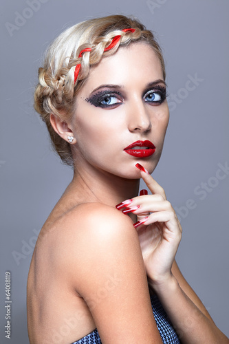 Young woman with red nails