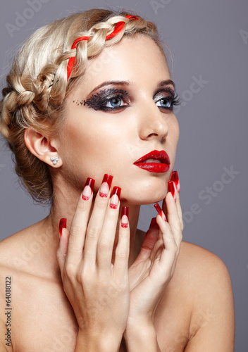 Young woman with red nails