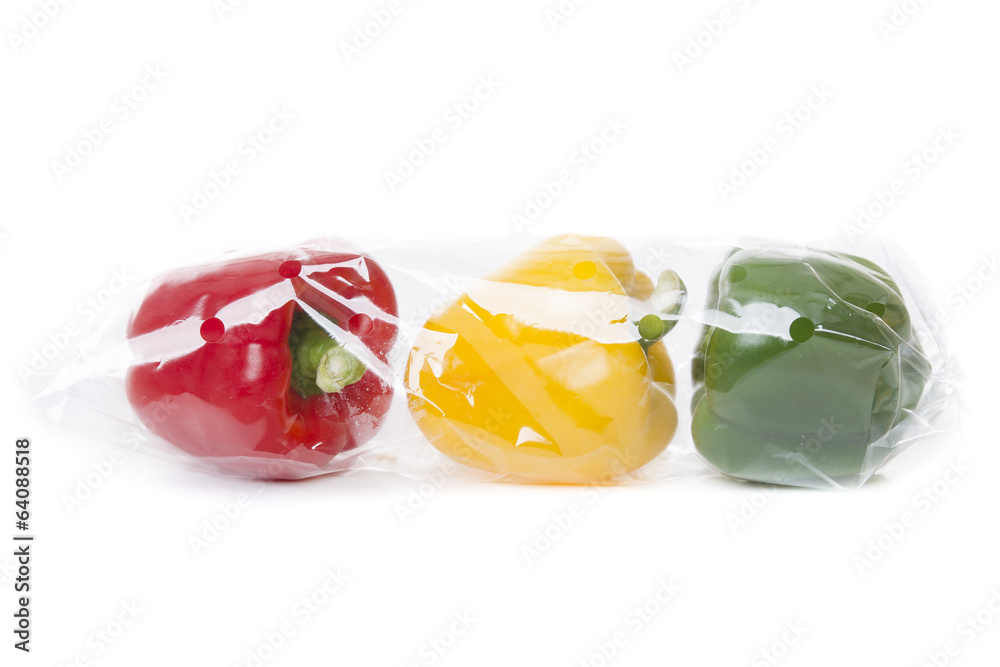 Fresh paprika isolated on white background in a transparent bag Fresh paprika isolated on white background in a transparent bag