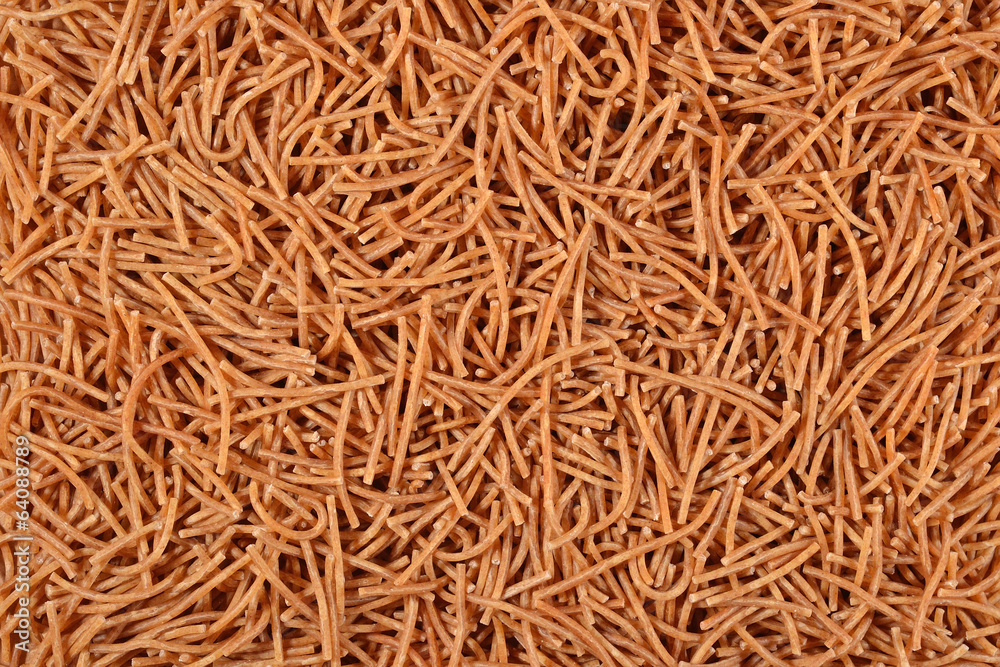 Whole wheat uncooked brown vermicelli  background