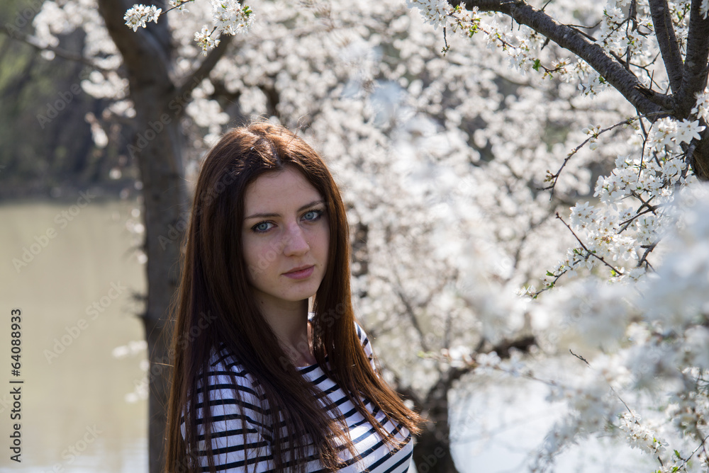 Young beautiful girl on a walk in the country