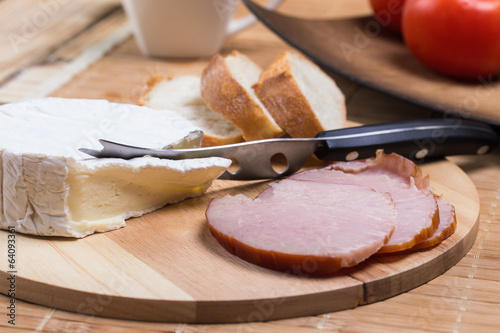 bread rolls with cheese and ham on the table photo