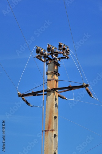 Power pole with external electric separator on top