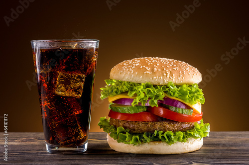 Homemade burger and coke on the wooden table