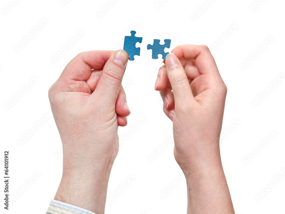 male and female hands with little puzzle pieces male and female hands with little puzzle pieces