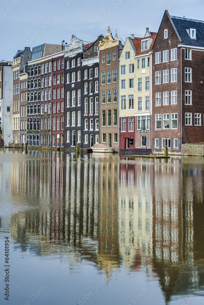 Fototapeta premium The Damrak canal in Amsterdam, Netherlands.