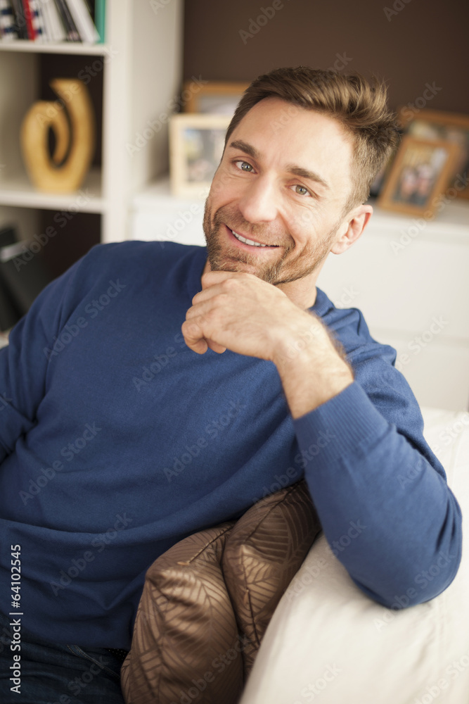 Fototapeta premium Portrait of handsome man on sofa