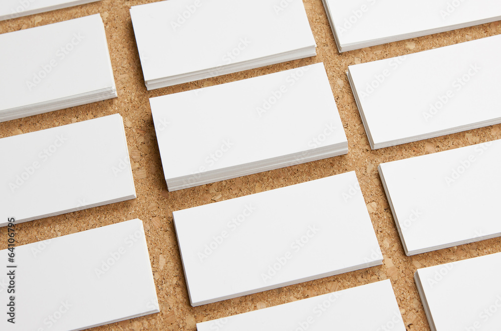 blank business cards on corkboard background
