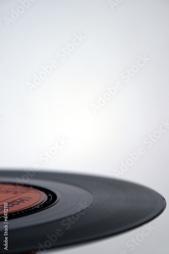 One-half of an analog 7-inch 45 rpm vinyl music record