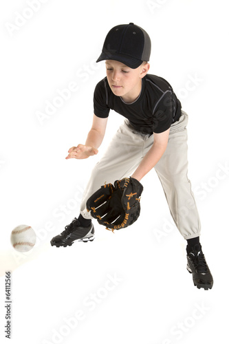 young caucasian baseball player catching a grounder