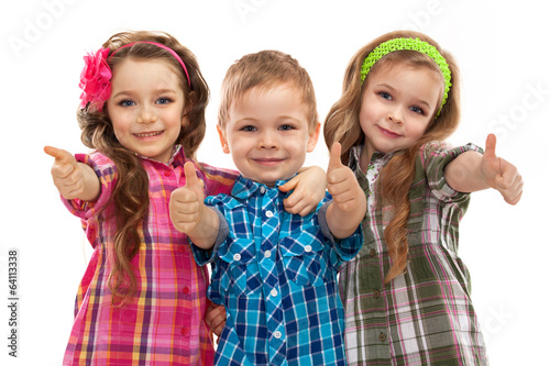 Cute fashion kids showing thumbs up