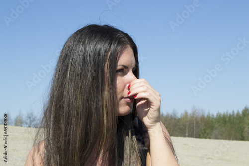 Fotografie Woman holding her nose (scent, smell, smelling)