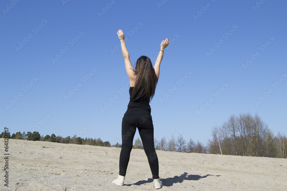 Woman stretching / working out at the beach (sunny day) Woman stretching / working out at the beach (sunny day)