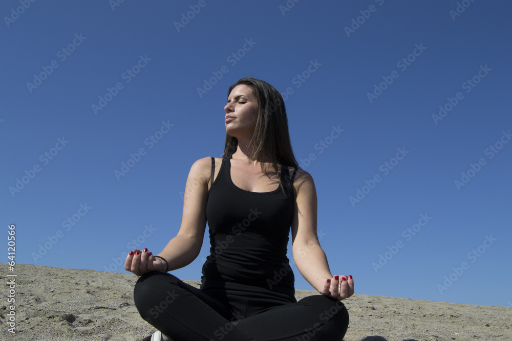 Woman - yoga - beach - meditation - healthy lifestyle