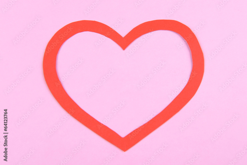 Paper heart on pink background