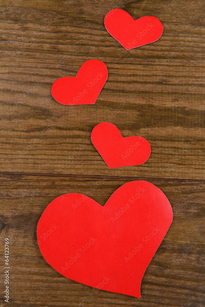 Paper hearts on wooden  background
