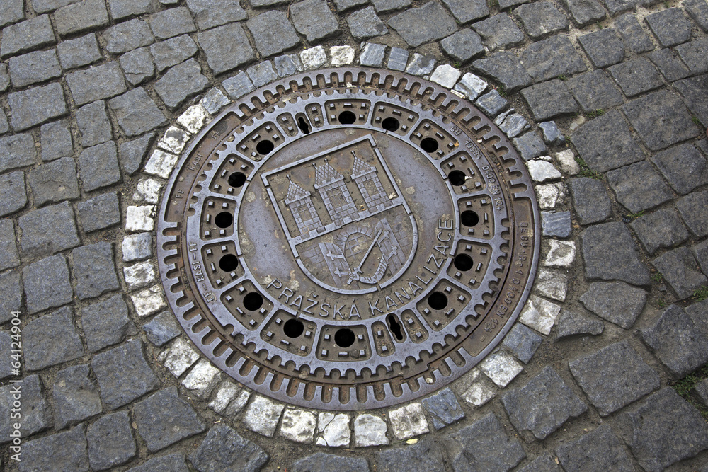 Manhole in the historical centre of Prague.