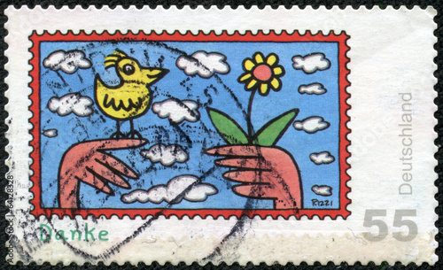 stamp showing children's drawing birds and flowers
