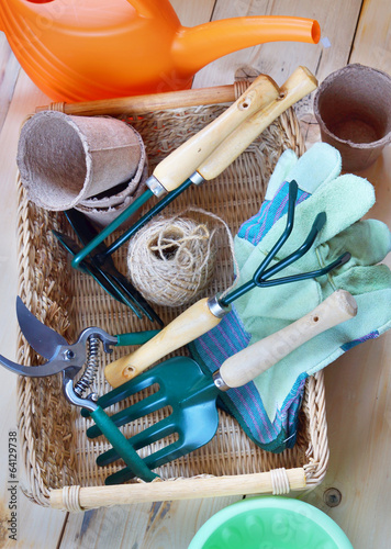 Gardening tools in a wicker basket