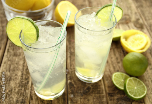 Cold lemon drinks with lime and ice