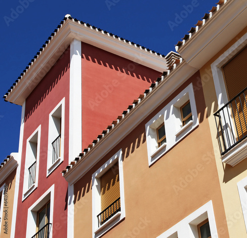 Spanish apartments, pastel colours and balconies against blue s © EdwardSamuel