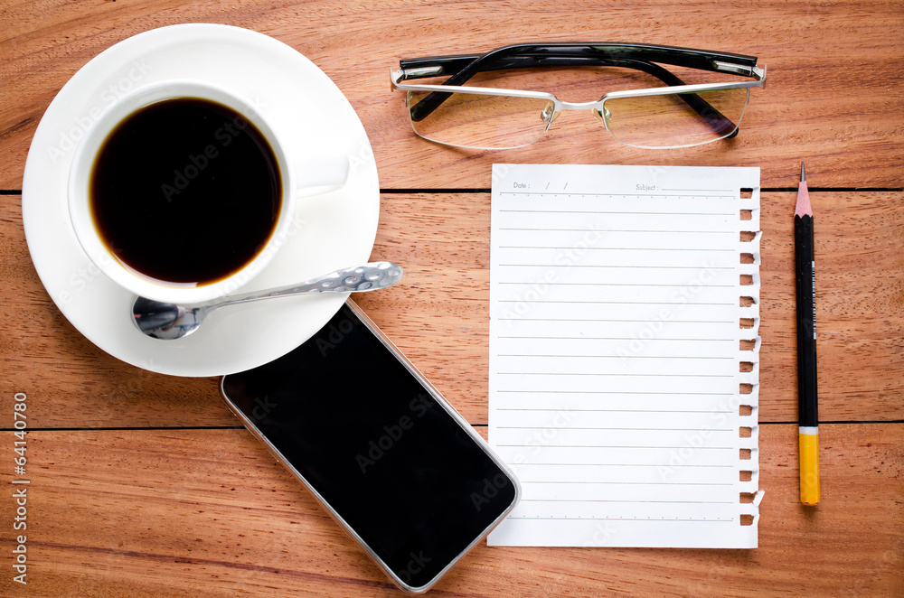 empty notebook and a cup of coffee empty notebook and a cup of coffee