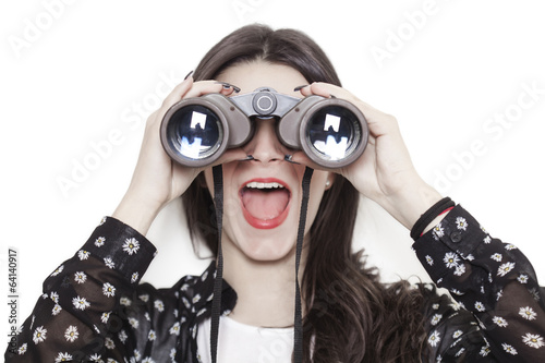 Surprised girl looking through binoculars