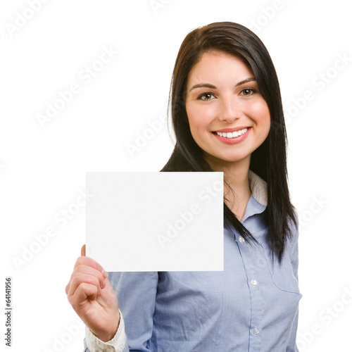 smiling young woman showing blank signboard