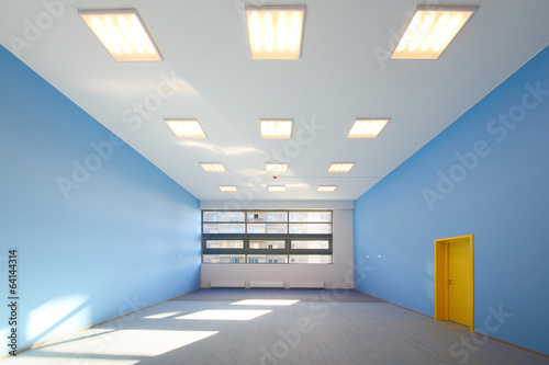 The playroom with blue walls and windows in childrens garden photo