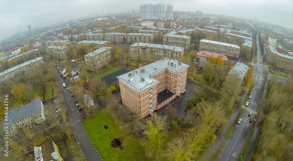 Fototapeta premium Road with cars acrossed residential areas with school