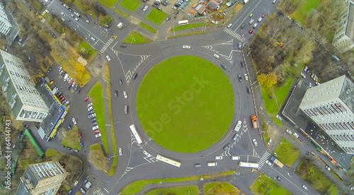 Road roundabout on square with green grass along photo