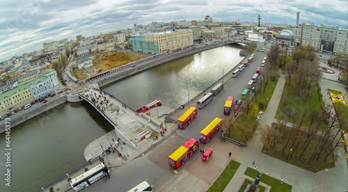 View from unmanned quadrocopter to buses near bridge photo