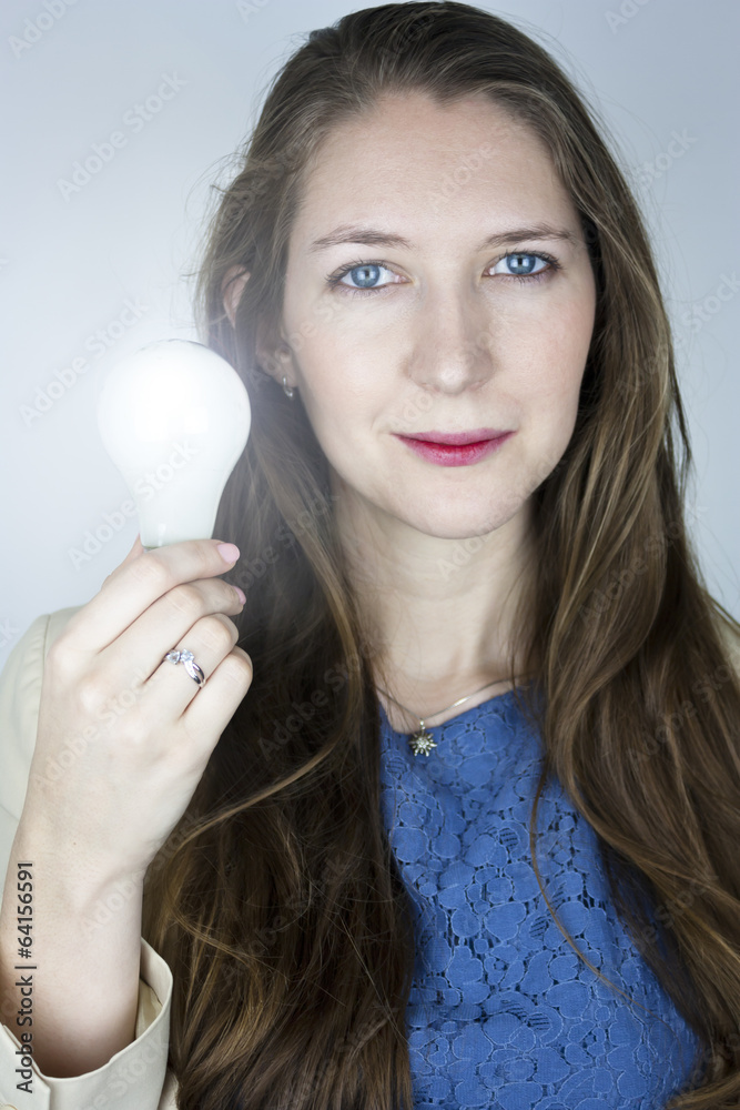Woman holding lit light bulb Woman holding lit light bulb