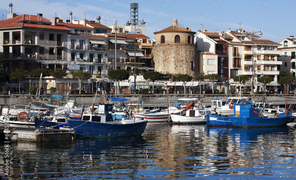 the port with yachts and boats and waterfront cafes in the resor
