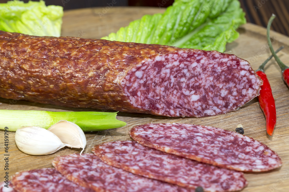 sausage on a wooden plate in a restaurant sausage on a wooden plate in a restaurant
