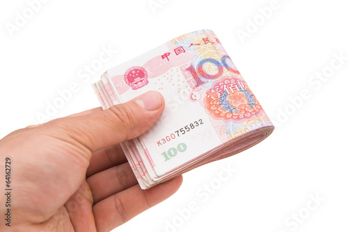 hand holding stack or RMB with clipping path