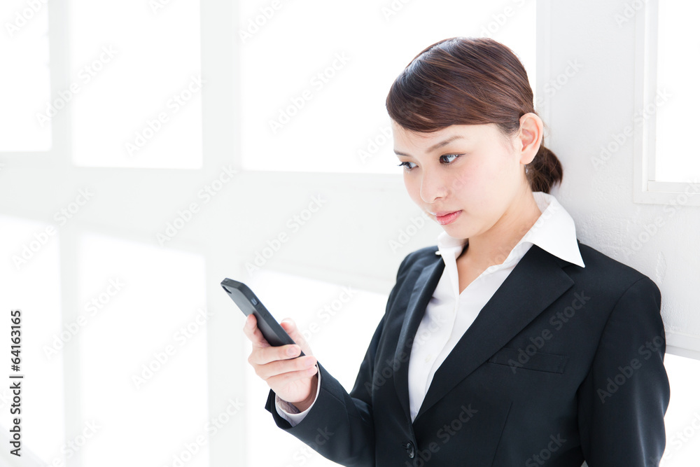 asian businesswoman using smart phone asian businesswoman using smart phone