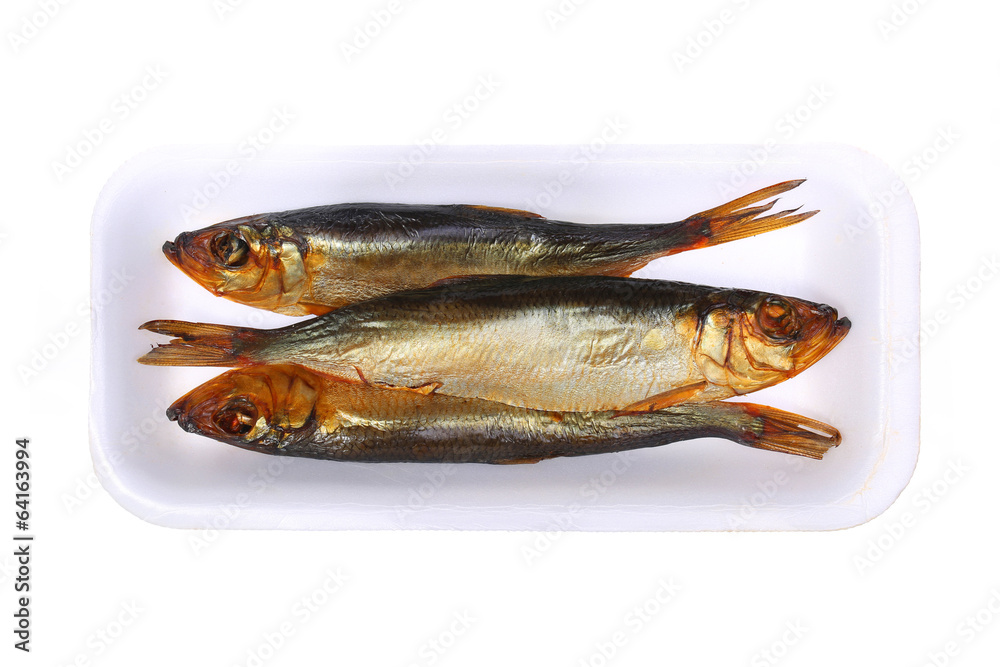 Smoked fish in the plastic plate, isolated Smoked fish in the plastic plate, isolated
