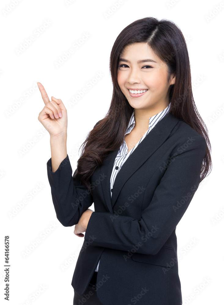 Smiling business woman finger pointing up Smiling business woman finger pointing up