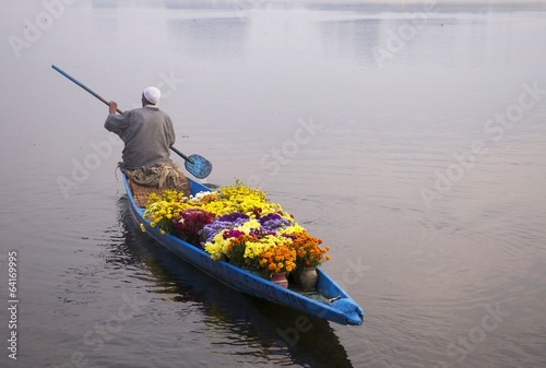 An old man selling flowers at Najeen lake Kashmir