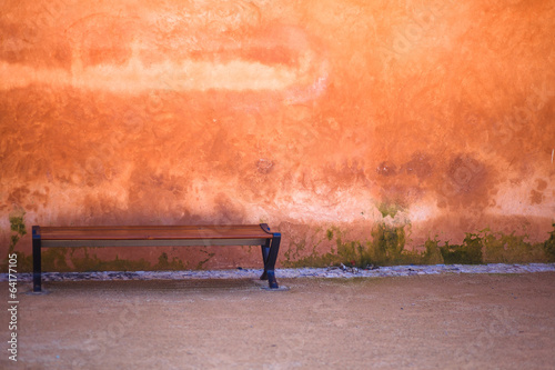Wallpaper Mural Street bench on a background of the red wall Torontodigital.ca