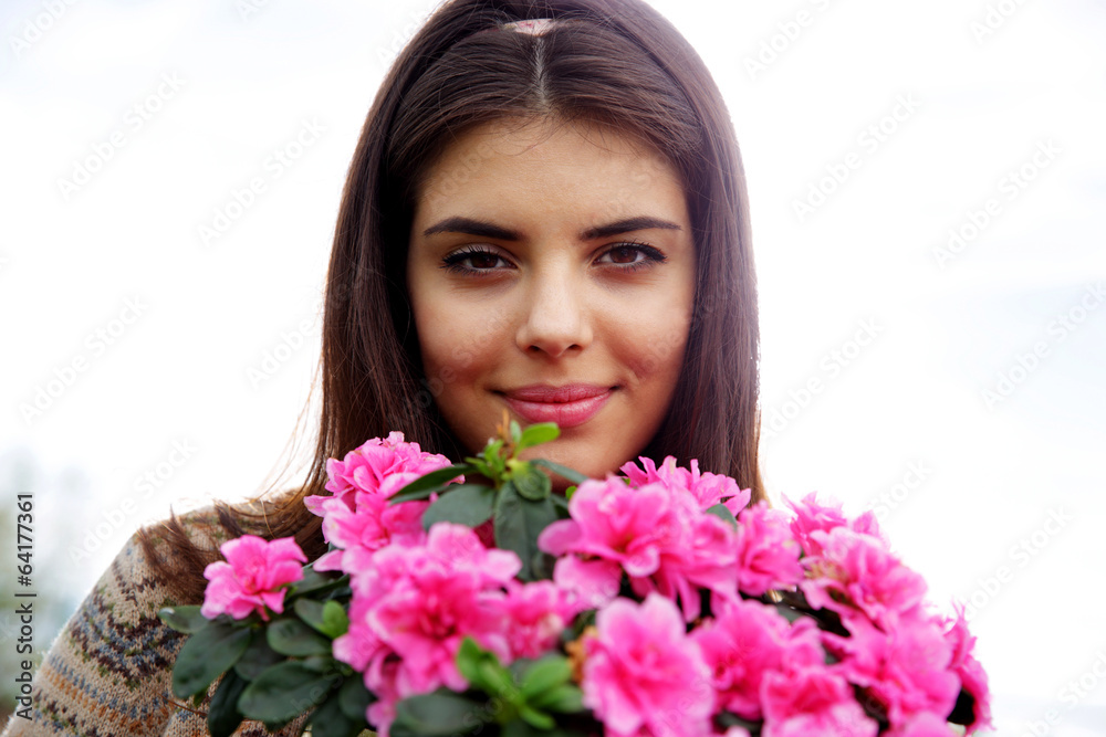 Closeup portrait of a young happy woman with flowers Closeup portrait of a young happy woman with flowers