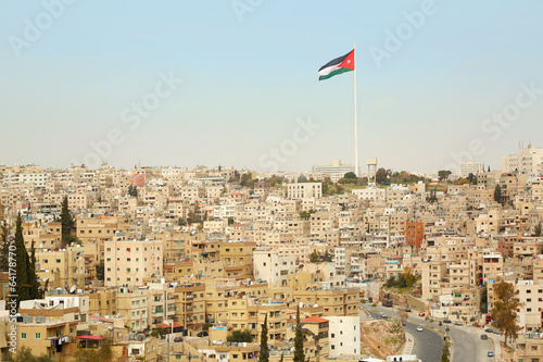 Amman city view with big Jordan flag