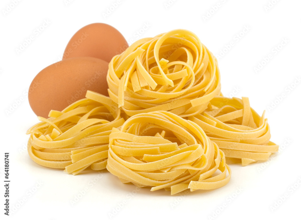 Italian egg pasta nest isolated on white background Italian egg pasta nest isolated on white background