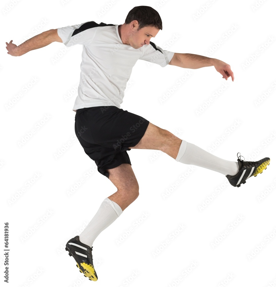 Fototapeta premium Football player in white kicking
