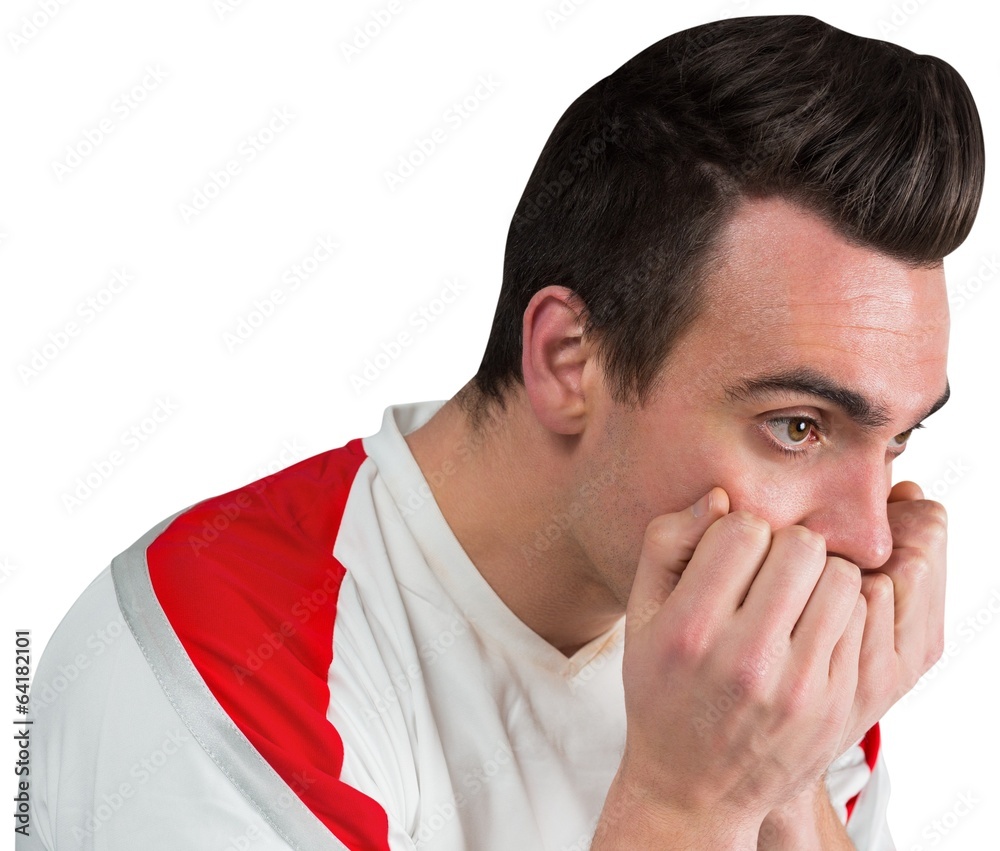 Disappointed football fan looking down Disappointed football fan looking down
